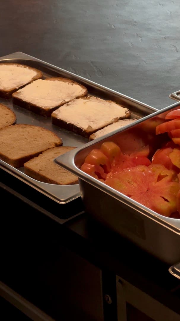 Slices of bread being laid out on trays
